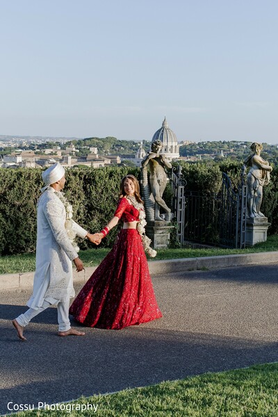 couple,red lehenga,white kurta,floral garlands,lehenga,kurta