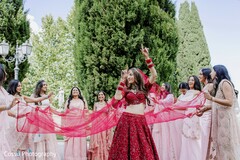 Vibrant Red Lehenga Celebration with Bridal Party Fabric Pose