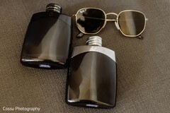 Groom's Style Essentials: Black Cologne Bottles & Ray-Ban Sunglasses