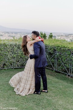 Couple Embraces Outdoors with Distant Hills