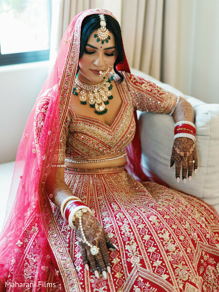 red lehenga,bridal fashion,south asian wedding,bridal jewelry,mehndi,green and gold necklace,red and gold embroidery,matha patti