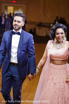 Happy Indian Couple Entering their Wedding Reception indian wedding,indian wedding reception