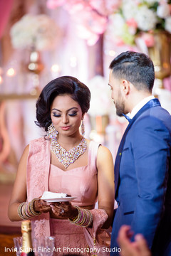 Indian Couple Having A First Taste Of Their Wedding Cake Indian Couple Having A First Taste Of Their Wedding Cake