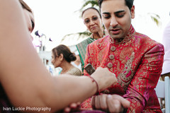 Indian groom getting a henna tattoo in his arm. Indian groom getting a henna tattoo in his arm.