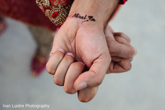 Groom showing hist romantic henna tattoo. Groom showing hist romantic henna tattoo.