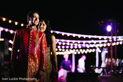 Indian bride and groom during their Outdoor mehndi party. Indian bride and groom during their Outdoor mehndi party.