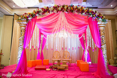 Beautiful hot pink glowing mandap.