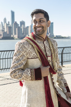 Indian groom ready in his red and beige wedding attire. Indian groom ready in his red and beige wedding attire.