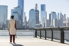 Indian groom looking at the skyscrapers and waiting to see his beautiful bride. Indian groom looking at the skyscrapers and waiting to see his beautiful bride.