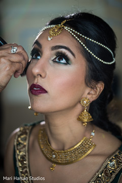 Make up artist adding the final touches. Make up artist adding the final touches.