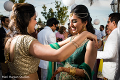 Indian bride welcomes the guests to pre -wedding beach party. Indian bride welcomes the guests to pre -wedding beach party.