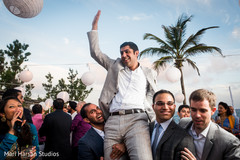 Indian Groomsmen carrying the groom on their shoulders. Indian Groomsmen carrying the groom on their shoulders.