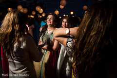 Guests dancing during pre-wedding seaside party. Guests dancing during pre-wedding seaside party.