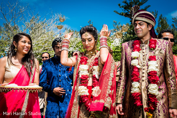 Indian bride showered in rice.