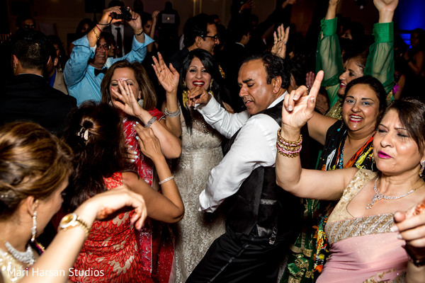 Guests dancing and celebrating at the wedding reception.