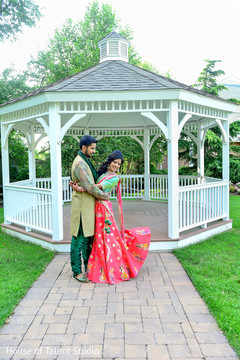 Bride and groom ready in their colorful garba outfits. Bride and groom ready in their colorful garba outfits.