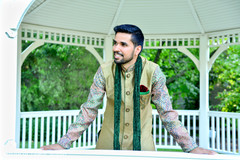 Indian groom wearing a beautiful green sherwani. Indian groom wearing a beautiful green sherwani.