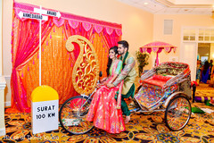 Indian bride and groom riding a colorful rickshaw. Indian bride and groom riding a colorful rickshaw.