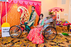 Indian bride and groom posing in lovely colorful rickshaw. Indian bride and groom posing in lovely colorful rickshaw.