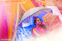 Indian bride holding a colorful umbrella on sangeet night. Indian bride holding a colorful umbrella on sangeet night.