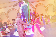 Stunning indian couple dancing on sangeet night. Stunning indian couple dancing on sangeet night.