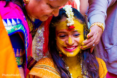 Indian bride smiling during haldi ceremony. Indian bride smiling during haldi ceremony.