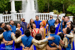 Fun photo of Indian groom and bride with bridesmaids and groomsmen. blue saris,indian bridesmaids,indian groomsmen,indian wedding photography session