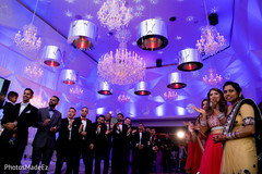 Guests awaiting for the grand entrance of bride and groom. indian wedding reception lighting,indian wedding decoration,indian wedding reception
