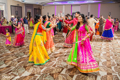 Traditional stick dance at Garba celebration. indian wedding garba,pre- wedding celebrations