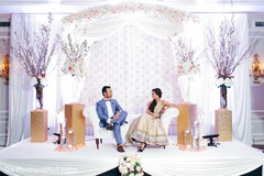 Indian couple posing in the reception stage. Indian couple posing in the reception stage.