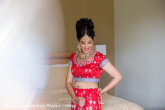 Stunning indian bride ready in he red bridal wedding attire. Stunning indian bride ready in he red bridal wedding attire.