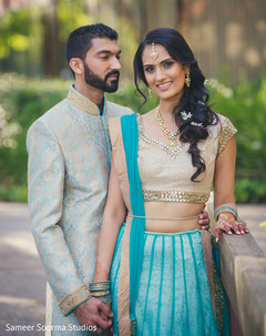 Indian bride and groom in matching light blue outfits. Indian bride and groom in matching light blue outfits.