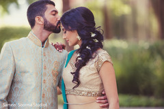 Indian groom kissing his lovely bride. Indian groom kissing his lovely bride.