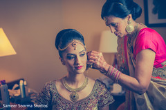 Gorgeous bride getting the final touch ups before the ceremony. Gorgeous bride getting the final touch ups before the ceremony.