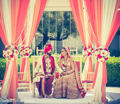 Beautiful coral and white draped and flower mandap. Beautiful coral and white draped and flower mandap.