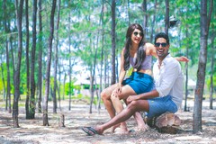 Sweet indian couple posing during beach side pre-wedding celebration. destination wedding photography,indian bride