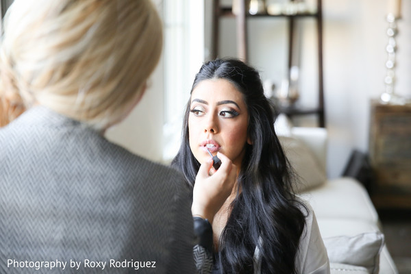 Makeup artist preparing bride for the reception
