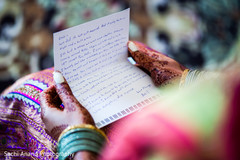 Indian bride reading a letter from the groom. indian bride,indian wedding gallery,indian wedding photography