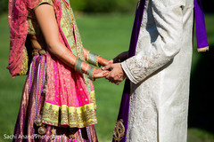 Cute capture of indian bride and groom holding hands. indian wedding photography,indian bride,indian wedding gallery