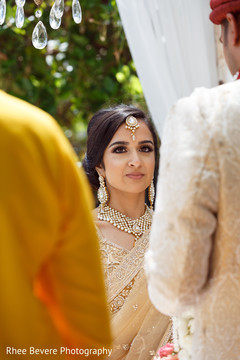 Indian bride at the ceremony with lovely tikka Indian bride at the ceremony with lovely tikka