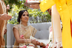 Indian bride and groom holding hands at the ceremony Indian bride and groom holding hands at the ceremony