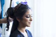 Beautiful indian bride getting her hair done. Beautiful indian bride getting her hair done.