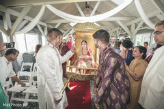 Indian bride entering the ceremony in a palanquin. Indian bride entering the ceremony in a palanquin.