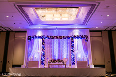 White and purple floral stage