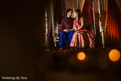 Sweet indian couple posing in their sangeet stage. Sweet indian couple posing in their sangeet stage.