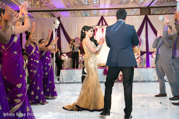 Bridesmaids and groomsmen welcoming the couple