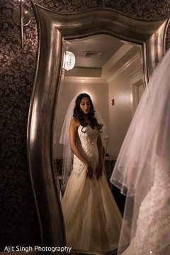 Charming maharani taking a final look to her bridal attire. Charming maharani taking a final look to her bridal attire.