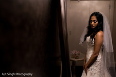 Indian bride taking a final glimpse. Indian bride taking a final glimpse.