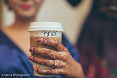 Indian bride drinking coffee while getting ready . Indian bride drinking coffee while getting ready .