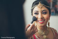 Dazzling indian bride getting her makeup done. Dazzling indian bride getting her makeup done.
